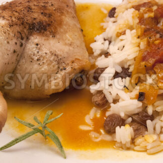 Entenschenkel in Currysauce mit Reis mit Rosinen Detail - Fotos-Schmiede